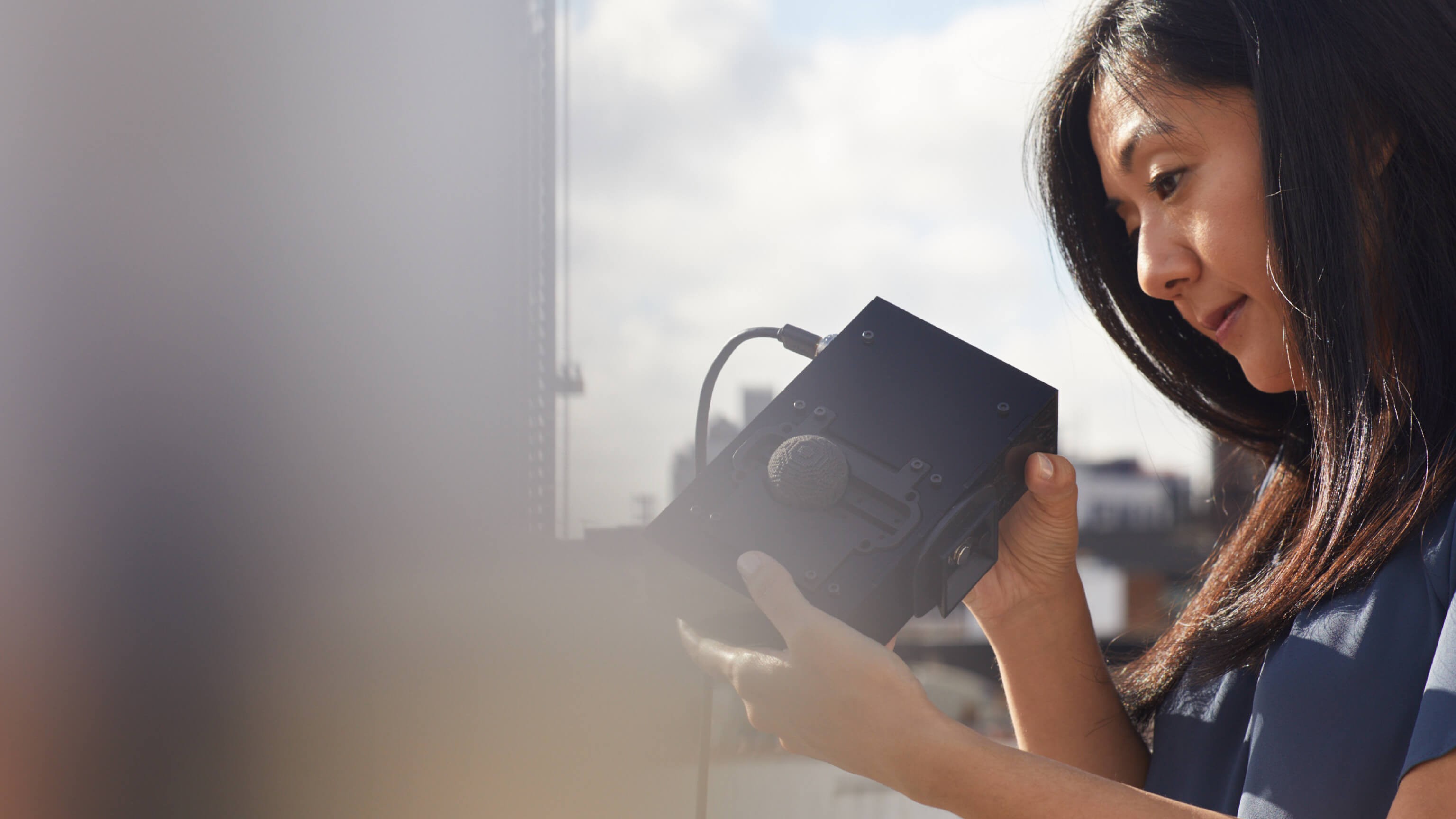 A Woman has a close look at a gadget at Urban X.